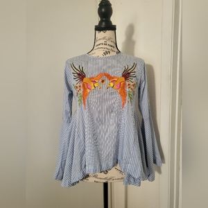 Blue and white striped top with stitched detail on front.